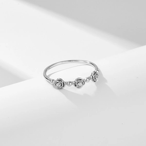 Elegant silver rose ring with sparkling cubic zirconia flowers in minimalist setting