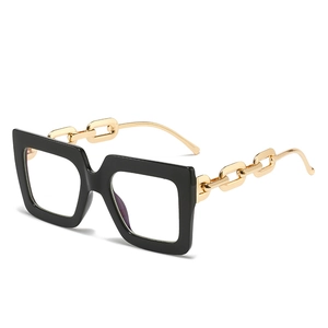 Modern oversized square glasses with black frame and gold metal chain temples