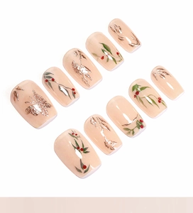Detail of square press-on nails with golden butterflies and red floral hand-painted art