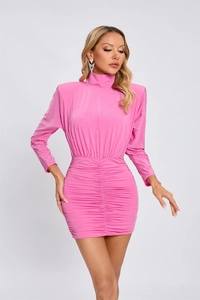Detailed view of pink bodycon dress featuring sparkling rhinestones and ruched fabric texture