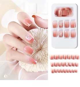 Press-on nail kit featuring 3D resin bear charms and pink gradient glitter finish