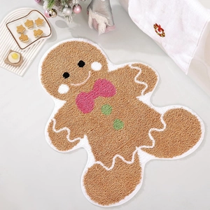 Gingerbread man shaped Christmas doormat in brown tufted fabric with festive decor