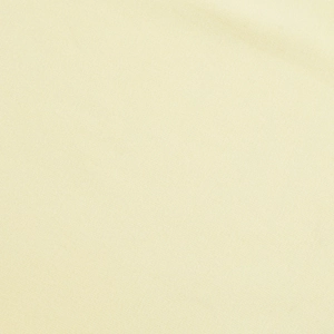 Gros plan sur la texture du tricot beige montrant les coutures fines et la matière douce