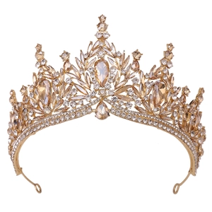 Macro shot of bridal crystal leaf crown with champagne rhinestones on gold metal base