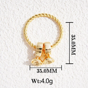Detailed view of a 35mm golden twisted hoop with small bell charms, weight 4.0g