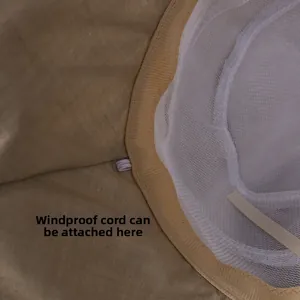 Detail of breathable mesh lining and windproof strap loop inside sun hat brim