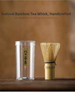 Detail of handcrafted 80 prongs bamboo matcha whisk with clear storage container
