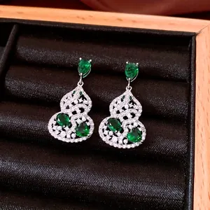 Exquisite silver hollow gourd earrings with green gemstones and white zircon pavé