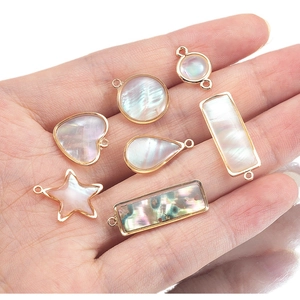Golden natural shell pendants in heart, star, and drop shapes for DIY jewelry making