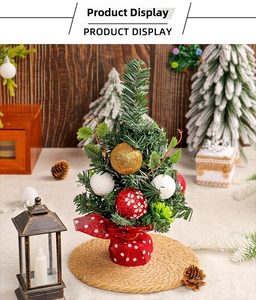 Detail of mini Christmas tree with red floral balls and red polka dot base decor