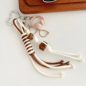 Handmade khaki woven rope keychain with mini headphones and heart-shaped metal carabiner