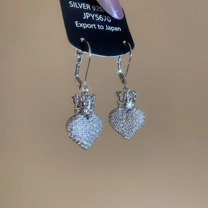 Detailed view of S925 silver leverback earrings with crown and zircon heart charms