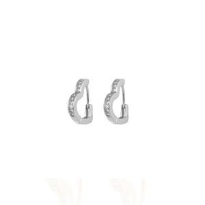 Close-up of heart-shaped silver hoop earrings with small cubic zirconia stones