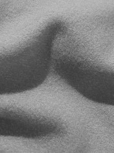 Close-up macro view of the soft black fleece fabric texture on men's winter cargo pants