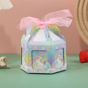 Detail of pink unicorn carousel candy box with octagonal design and soft tulle bow