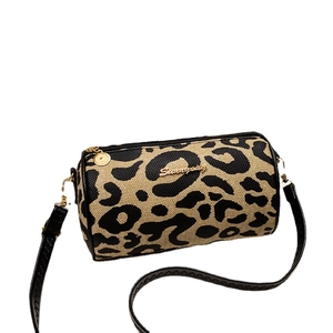 Vintage leopard print barrel shoulder bag with black strap and golden logo