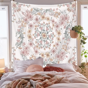 Floral mandala tapestry in pastel colors hanging above a bed for wall decor