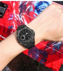 Wrist shot of a black dual display sport watch featuring WR 50M water resistance
