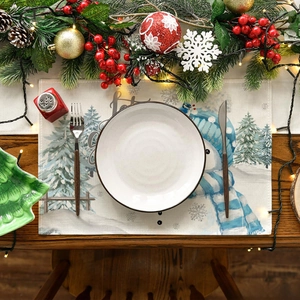 Christmas placemat with snowman and Let it Snow text on a festive wooden table