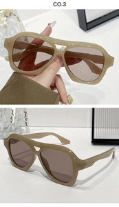 Detail of pilot sunglasses with beige chunky frames and iconic double bridge design
