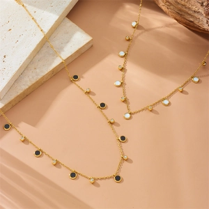 Gold plated stainless steel necklace set with geometric black and white zircon pendants