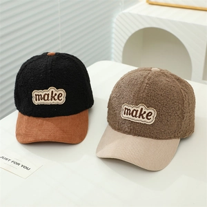 Detail of wool-like fleece baseball caps with corduroy brims and embroidered patches