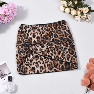 Detailed view of leopard print sequin mini skirt with cross knot design and glitter finish