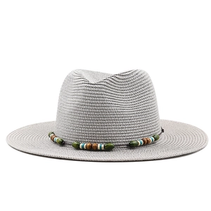 Grey straw panama hat with colorful bead decoration and flat brim for summer sun protection