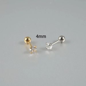 Detail of 4mm round cubic zirconia stud earrings with gold and silver ball screw backs