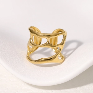 Irregular hollow titanium steel ring in gold finish with minimalist streamlined design