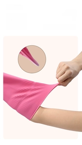 Pink latex cleaning glove showing high elasticity and strong tear-resistant material