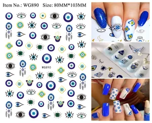 Close-up of Evil Eye nail art stickers with Hamsa Hand patterns and bohemian blue designs
