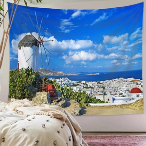 Detail of Santorini tapestry with white windmills and blue sea for room decor