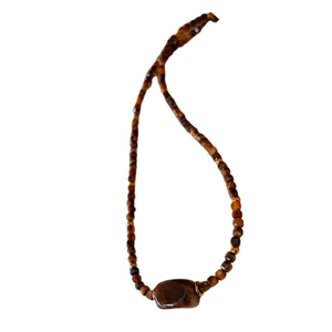 Retro faux tiger eye beaded necklace with amber and brown tones for a vintage look