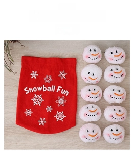 Detail of red drawstring bag with snowflake patterns and 10 plush snowballs with smiling faces