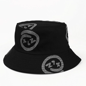 Detail of artistic grey graffiti ring pattern on black cotton double-sided bucket hat