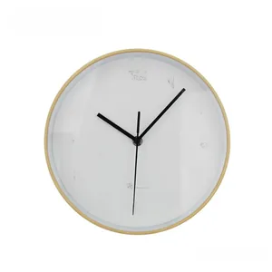 Front detail of round wooden wall clock with white dial and clear black numerals