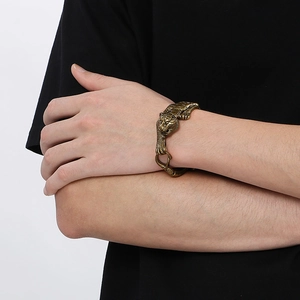 Vintage golden stainless steel tiger head bracelet for men on male model wrist