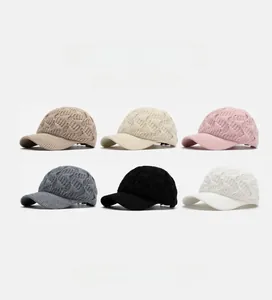 Detail of six colors of women's cable knit baseball caps with soft top texture