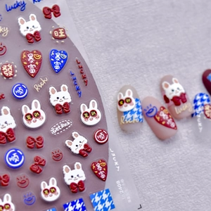 3D embossed nail stickers with cute white rabbits, lucky characters, and red bows