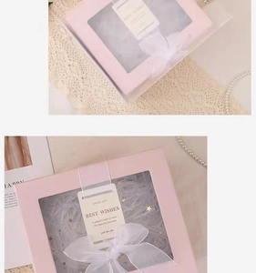 Pink gift box with transparent window, white ribbon bow and gift bag for favors
