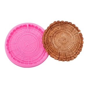 Round silicone mold for tree stump coasters featuring realistic annual ring texture