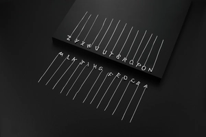 Detailed display of silver letter necklaces from A to Z on a professional display stand