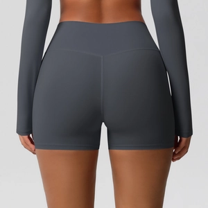 Detail view of dark grey high-waisted sports shorts with V-shaped back seams for booty lifting