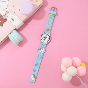 Detail of light blue silicone strap with 3D unicorn and rainbow motifs on kids quartz watch
