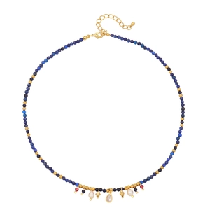 Bohemian beaded necklace with dark blue stones, pearls and clear teardrop pendant