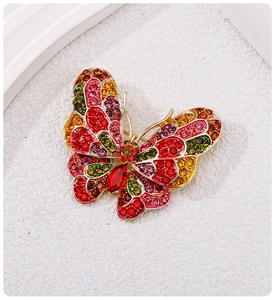 Detailed macro view of colorful rhinestone butterfly brooch with vibrant crystals