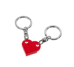 Detail of red interlocking building block heart keychain set with metal rings