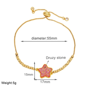 Detail showing pink druzy star charm and sliding adjustment on gold-plated bracelet