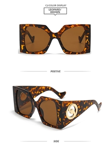 Detail view of leopard print square sunglasses with brown lenses and golden logo